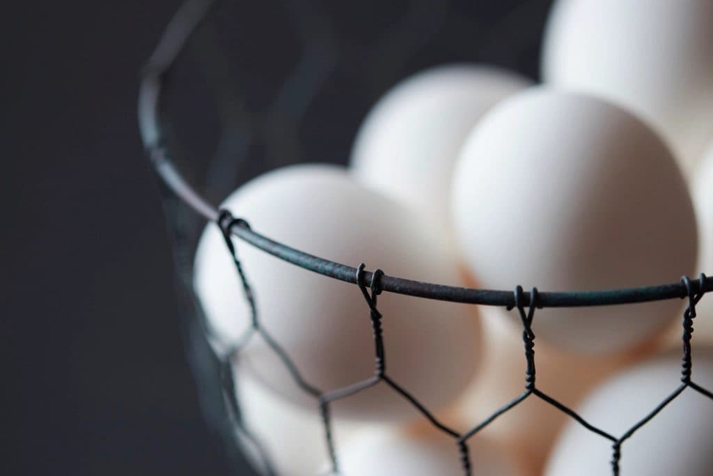White eggs in a wire basket